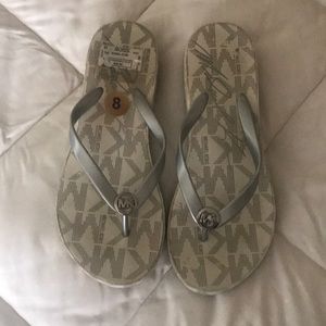 Michael kors flip flops.